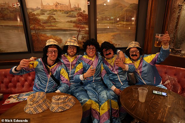 Photos show fans donning their best fancy dress as they down the pints to warm up for the big match