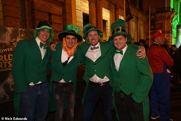 A group of fans dressed as leprechauns wait outside Alexandra Palace