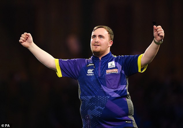 Luke Littler celebrates semi-final victory against Rob Cross on day fifteen of the Paddy Power World Darts Championship at Alexandra Palace