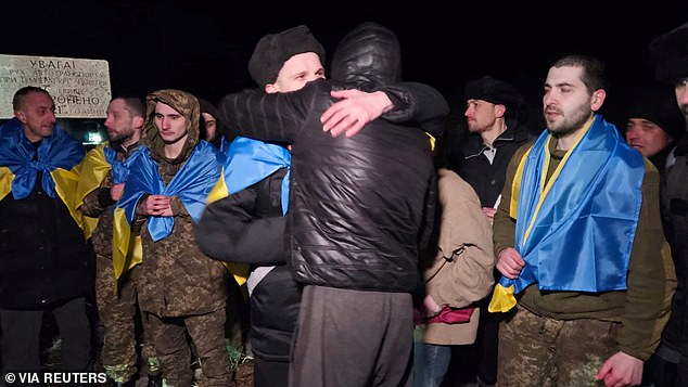 Ukrainian men hugged each other after being released by Russia in a major prisoner swap on January 3