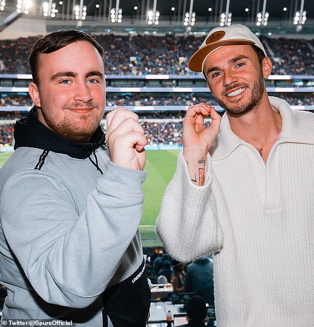 Luke Littler posed with injured Tottenham midfielder and avid darts fan James Maddison during Spurs' match against Bournemouth