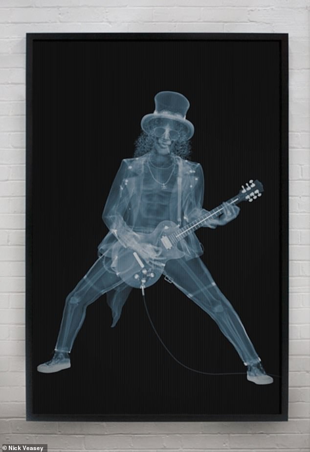 Best known for his X-ray prints of the Boeing 777, the Essex-born father of two convinced a dozen private car collectors to lend him their vintage vehicles and turned Guns N' Roses' Slash into a living skeleton (pictured)