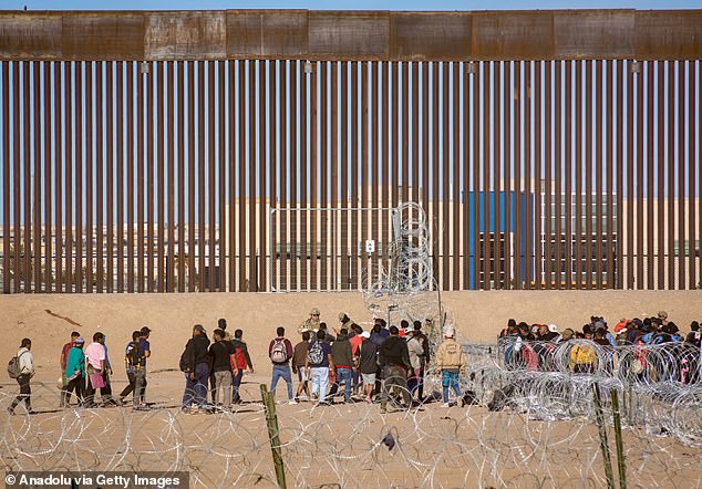 Texas National Guard detains migrants crossing the Rio Grande River to seek humanitarian asylum before crossing the border into the United States in Ciudad Juarez, Mexico on January 2, 2024