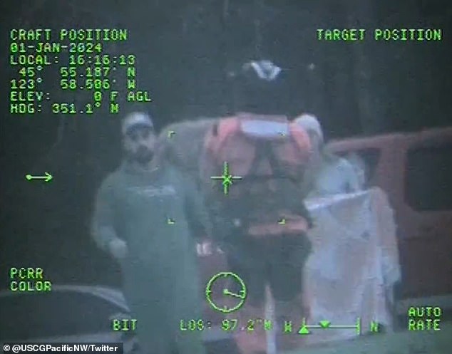 The Coast Guard officer is seen handing the injured dog to its concerned owners