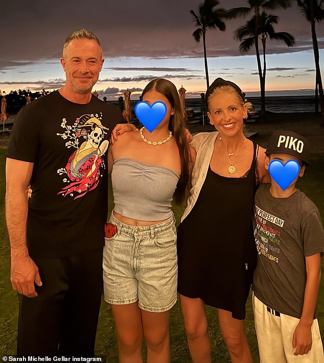 Another photo showed the parents hugging their two children as they enjoyed the beach at night