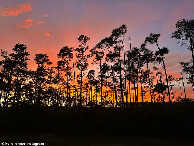 The reality star posted a sunset photo from her top-secret vacation spot