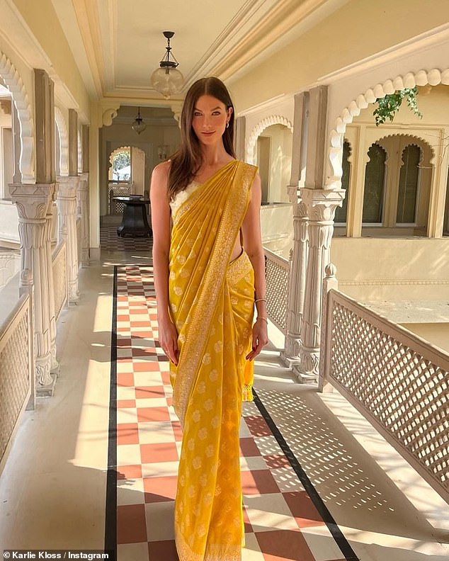 In another glamorous photo, Karlie embraced Indian culture in a vibrant yellow sari