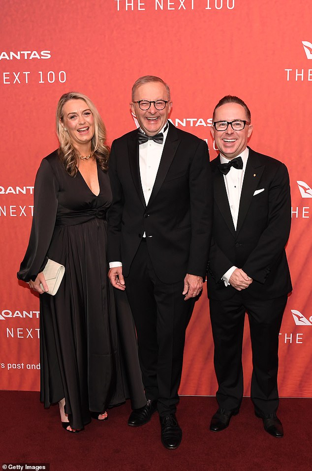 Longtime friends Anthony Albanese (centre) and Alan Joyce (right) were in good spirits as they were pictured on the red carpet at the 100th Qantas Gala Dinner in March.  Mr Albanese's partner, Jodie Haydon, pictured left