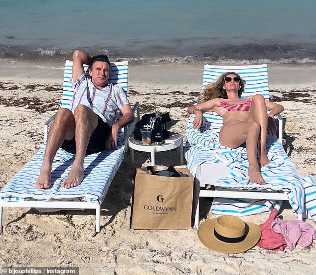 In one of the photos, Bijou lay on a lounge chair next to her brother-in-law Billy Baldwin