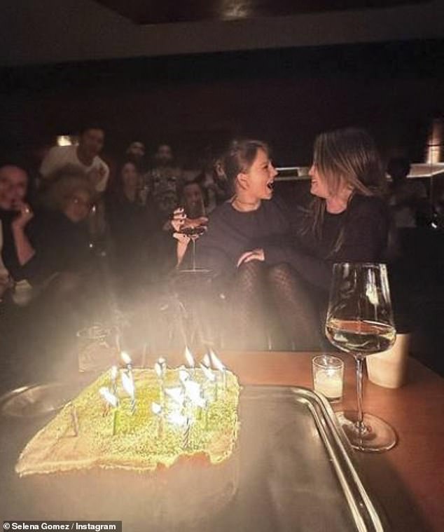 At another point, she celebrated with birthday girl Taylor and her friends, with a huge birthday cake and lit candles for them