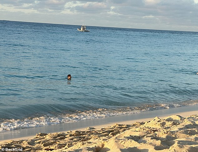 Harry seemed completely relaxed as he enjoyed a dip along the beautiful beach