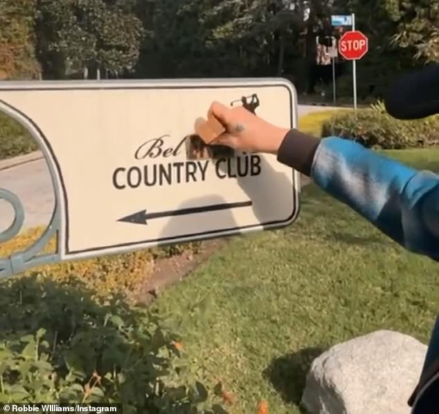 He replaced the 'Air' with 'Ends' and then covered the 'o' and 'r' in 'Country', turning the sign for the exclusive members-only club into an offensive phrase