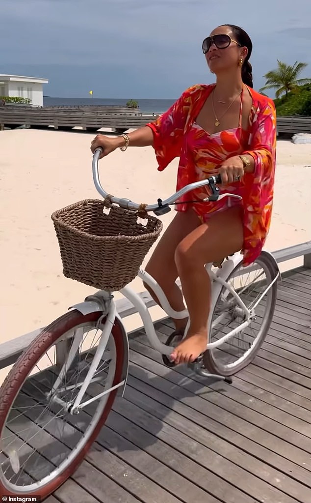 The radio host looked like she was having a great time as she drove along the pier with the beach in the background