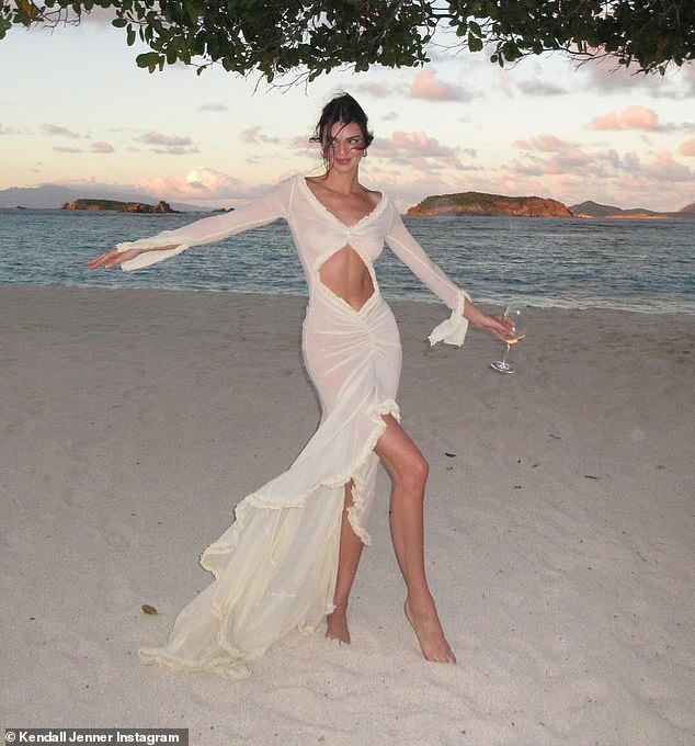 Kendall showed off her incredible figure in a sheer cream dress with cutouts that showed off her toned abs