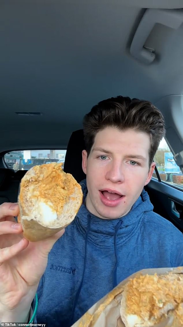 Connor holds up a close-up of this egg salad and chicken tikka sandwich before praising it
