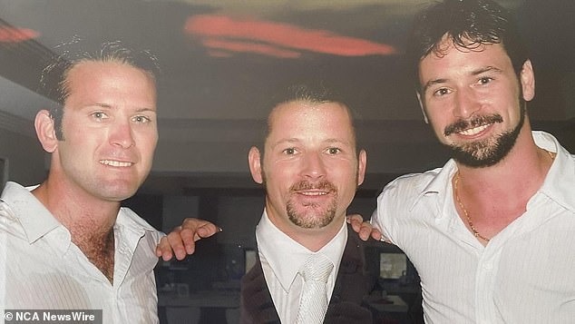 The 46-year-old's body was found the next morning by Queensland Police after a search by police divers and water police (Rory McGuire, right, with family members)