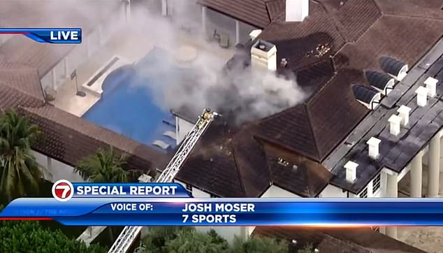 A helicopter captured images of firefighters working to extinguish the flames using a ladder