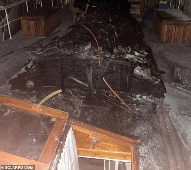 This image shows the charred deck of the boat