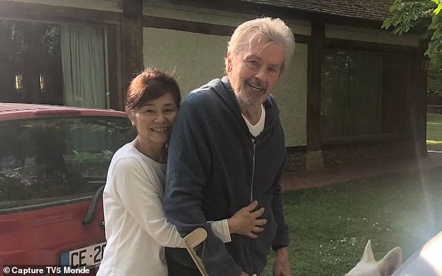 In July, the three children evicted Delon's (right) 60-year-old live-in partner, Hiromi Rollin (left), from the estate they shared in Douchy-Montcorbon, south of Paris.