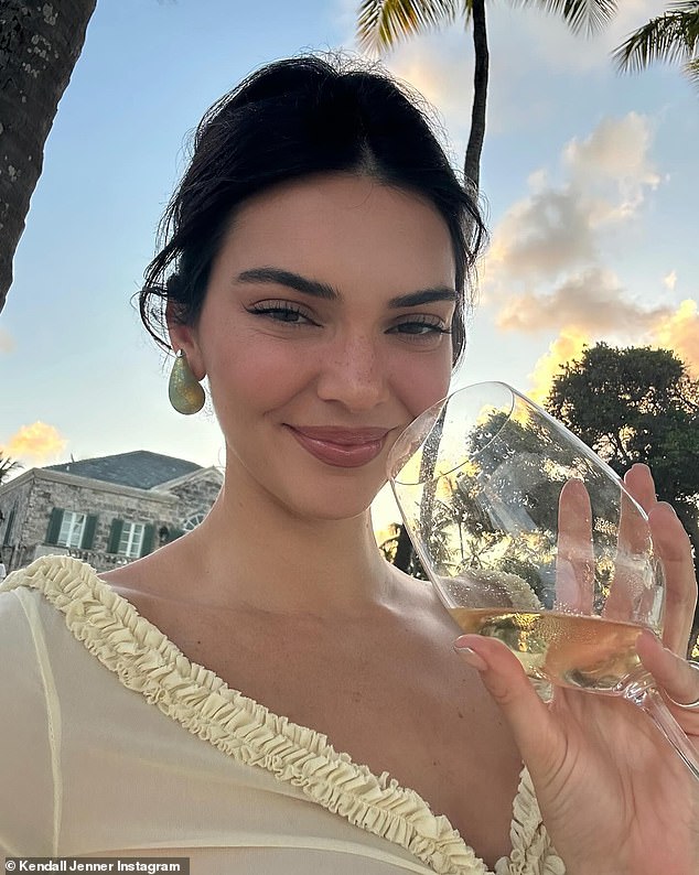 Kendall wasted no time enjoying a glass of wine