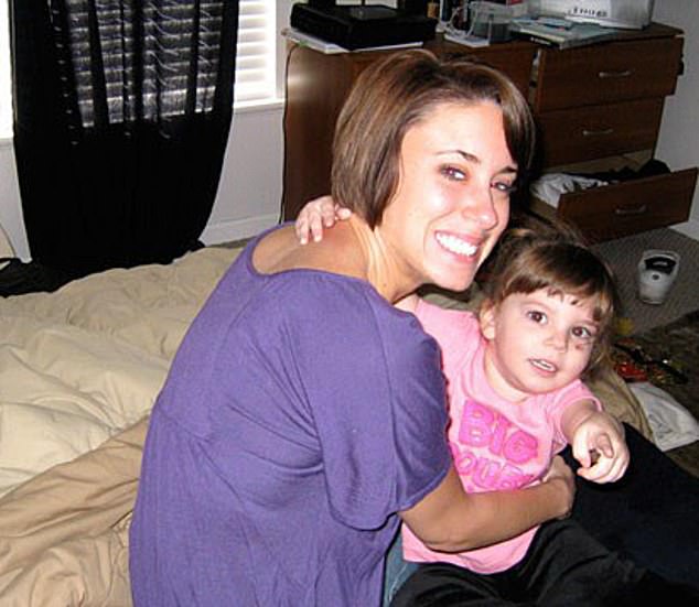 Casey Anthony, who was holding her daughter Caylee, was initially charged with her daughter's murder in 2008