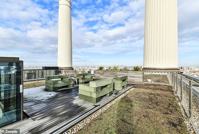 The impressive property features a large outdoor seating area under one of four iconic chimneys