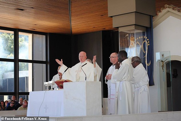 Father Sean Knox (pictured) from Tallahassee, Florida, officially inaugurated Binny with a few drops from his pint, saying: 'I now bless you the official mascot of the Disney Day Drinkers Club'