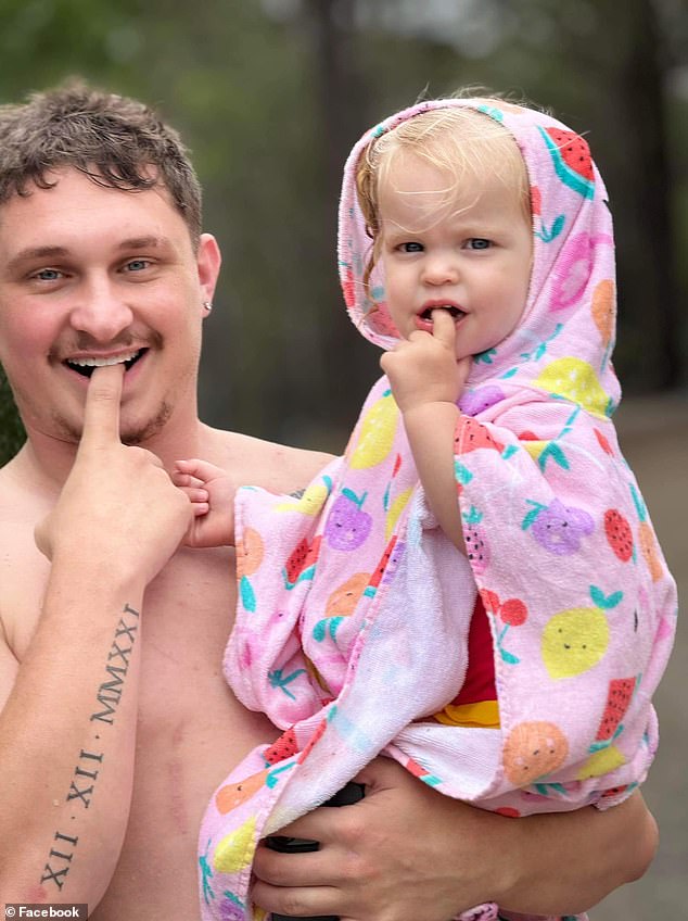 Kevin Malligan is pictured with his daughter Ivy, aged two.  His wife had another child in February