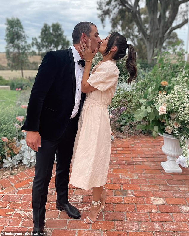 Dawson's teammate Taylor Walker (pictured with wife Ellie at the ceremony) was just one of many big-name footballers celebrating the couple's wedding