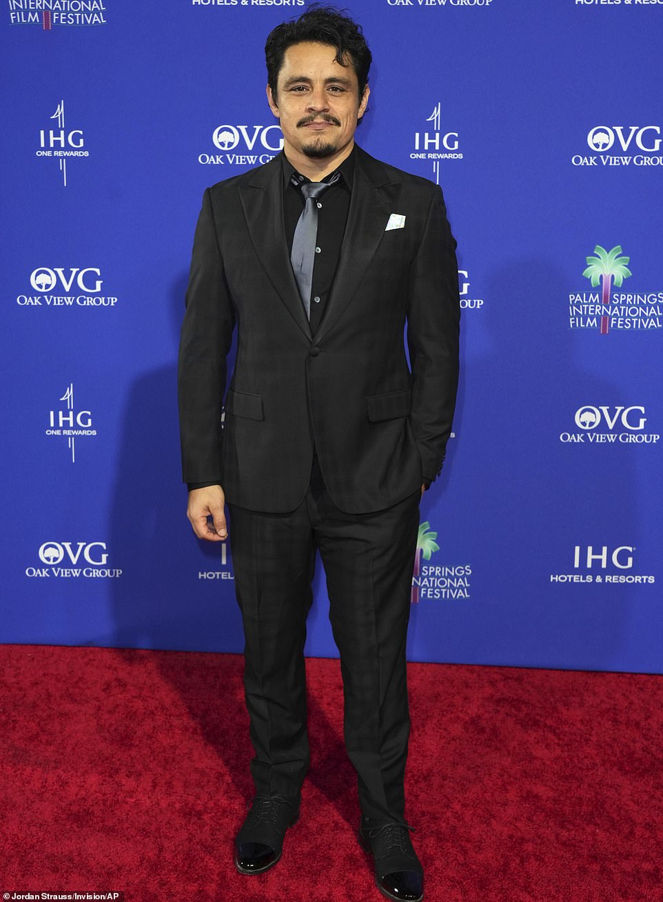 Jesse Garcia, who plays Richard Montanez in the film, cut a dashing figure at Thursday's awards ceremony in Palm Springs, wearing his tie carelessly askew over an open button.