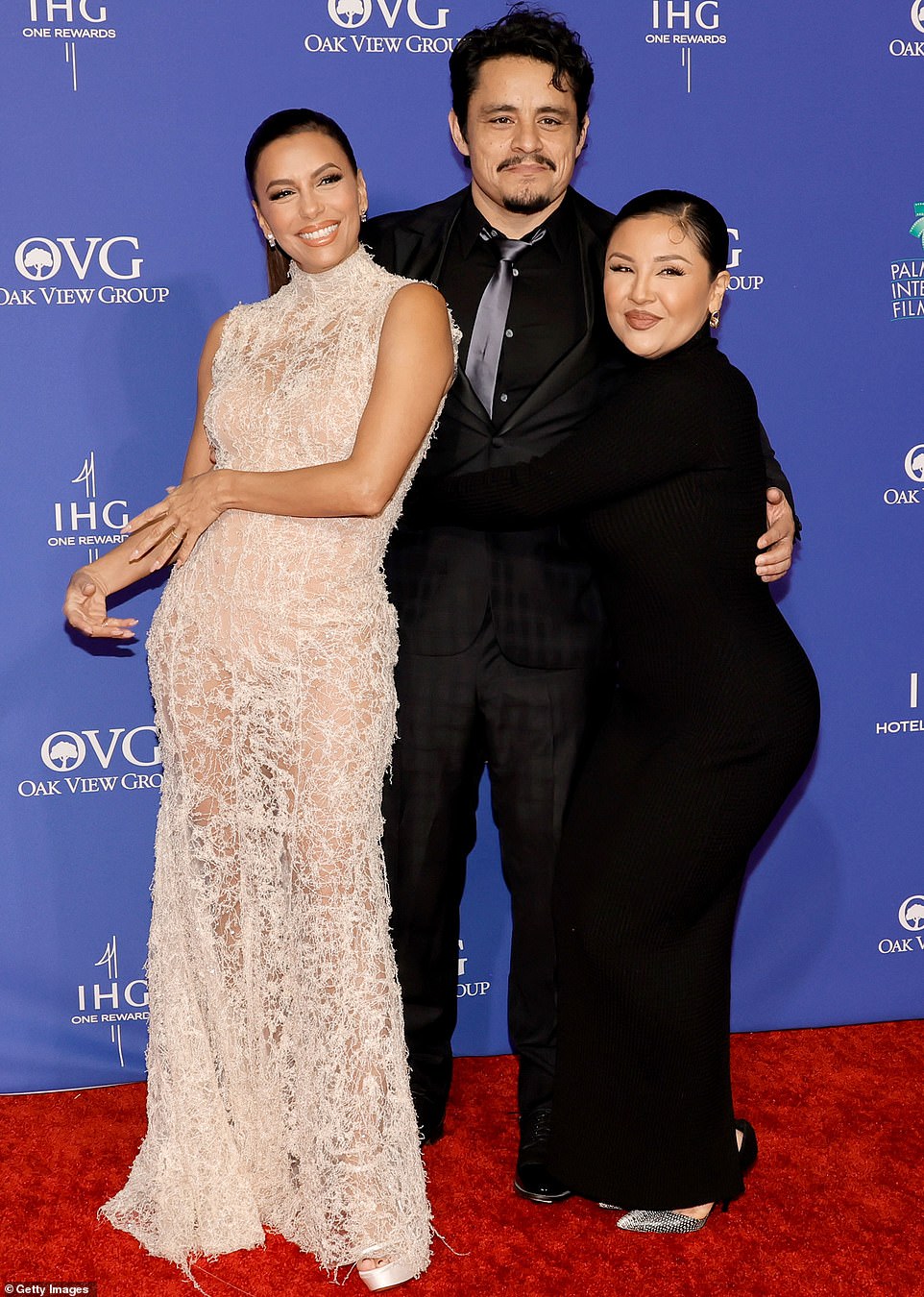 In a charming group photo to remember, Jesse posed on the red carpet while sandwiched between his director and his Flamin' Hot leading lady Annie Gonzalez