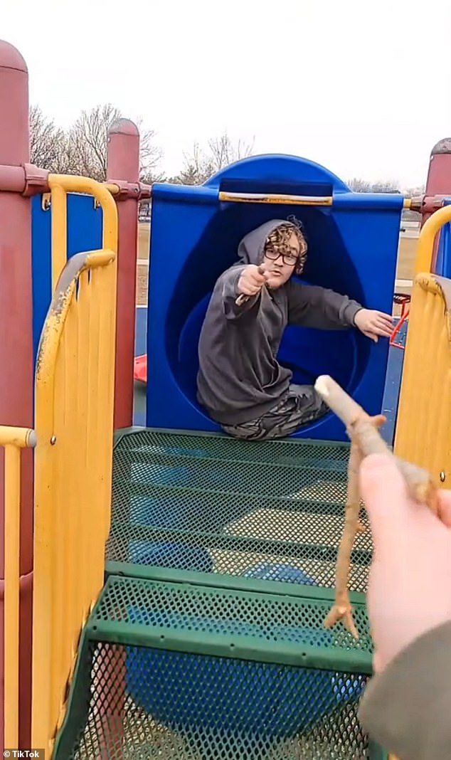 In December, just weeks before the shooting, Butler posted another video to the same social media account of himself sitting on the children's playground equipment with a friend and pretending to be in a gunfight with sticks.