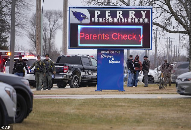 A sign is projected on site that informs parents what to do when they arrive at the school