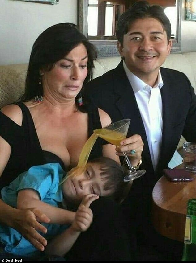 A couple's family photo also didn't go quite to plan when the mother's orange cocktail fell over and the liquid ended up on their son