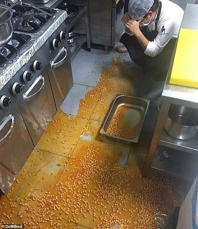 A disappointed-looking chef dropped a full container of beans, which then covered the entire floor