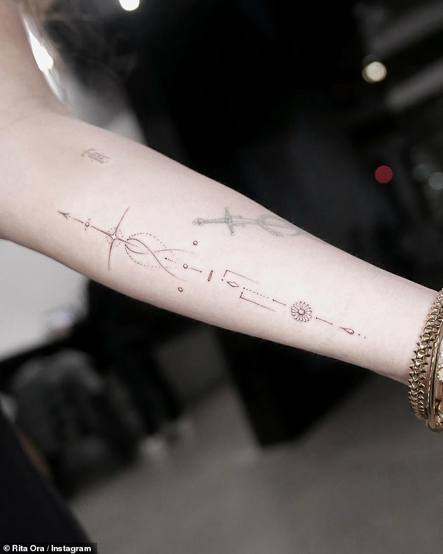 The 33-year-old singer took to Instagram on Friday and shared photos of the moment she completed her extensive tattoo collection with an arrow designer on her forearm