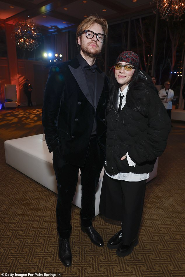 singer Billie Eilish posed with her co-writer Finneas.