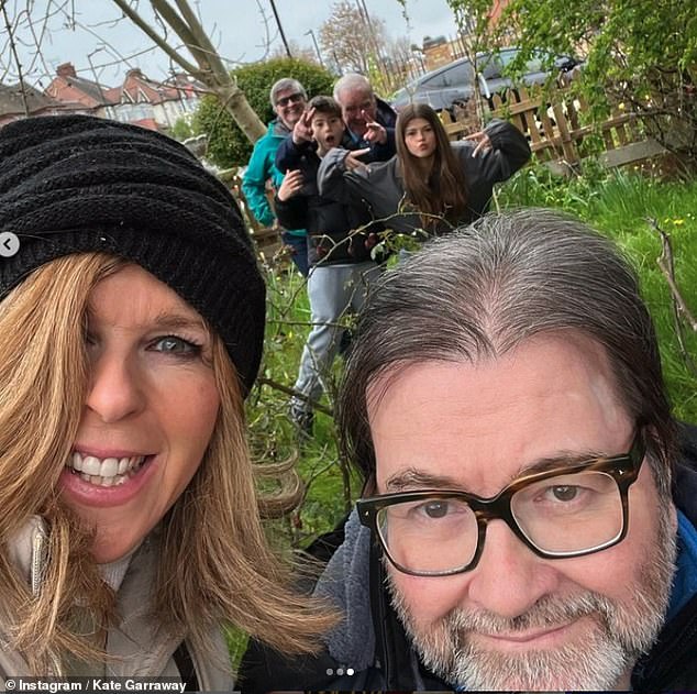 Derek returned from hospital after 13 months but never fully recovered (pictured with his family in their garden)