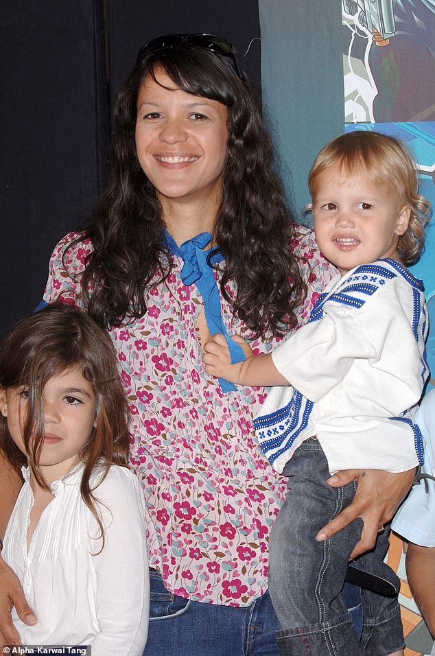 Lisa is pictured with the two rockers' children: Molly and Astile in 2005