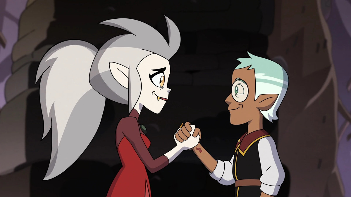 An image of Eda and Raine from Owl House looking at each other.  They stand facing each other while holding hands and smiling.