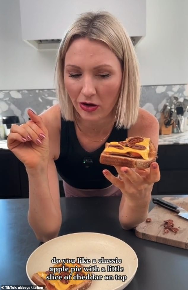 A woman adds apples, butter, brown sugar, processed cheese, brown bread and nuts to make her rat snack