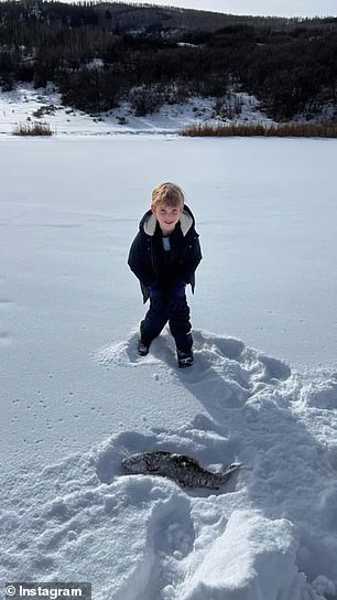 Ivanka captured her children lying in the snow and posing with the fish they caught