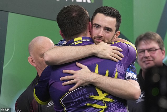 After the defeat, Littler and Humphries embraced on the Alexandra Palace podium