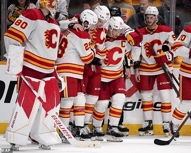 The defenseman had to be helped off the ice by his teammates during the Flames' win