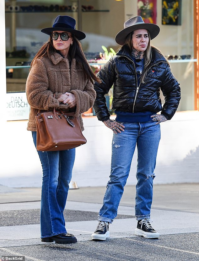 Morgan wore a black puffer jacket, faded denim and a wide-brimmed hat as she pounded the sidewalks in a pair of Louis Vuitton high tops