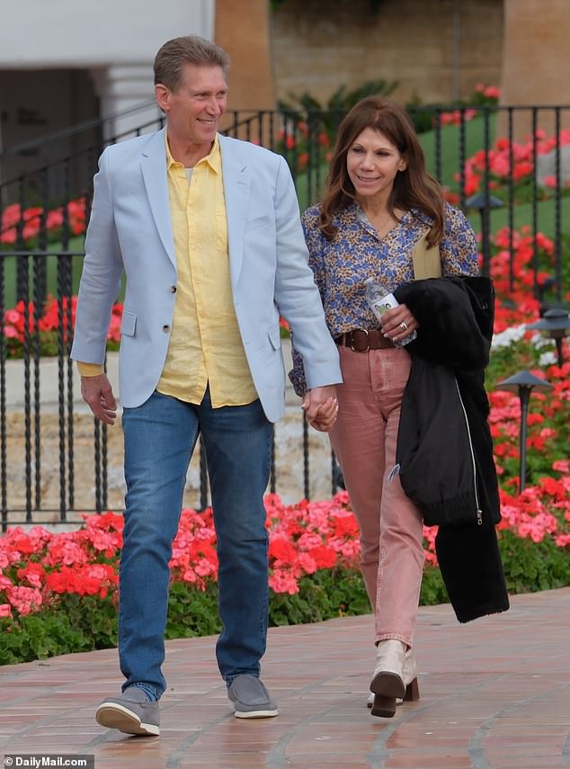 Nist wore coral chinos, paired with white boots and a blue floral blouse, while her new husband was smartly dressed in jeans, a light blue linen blazer and a bright yellow shirt.