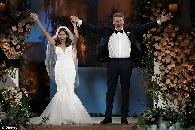 Gerry and Theresa raised their arms in triumph after being named husband and wife