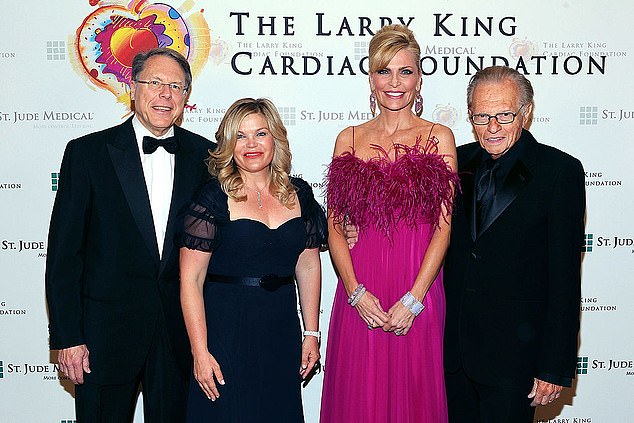 LaPierre is pictured with his wife Susan in 2012;  the late Larry King and his wife Shawn