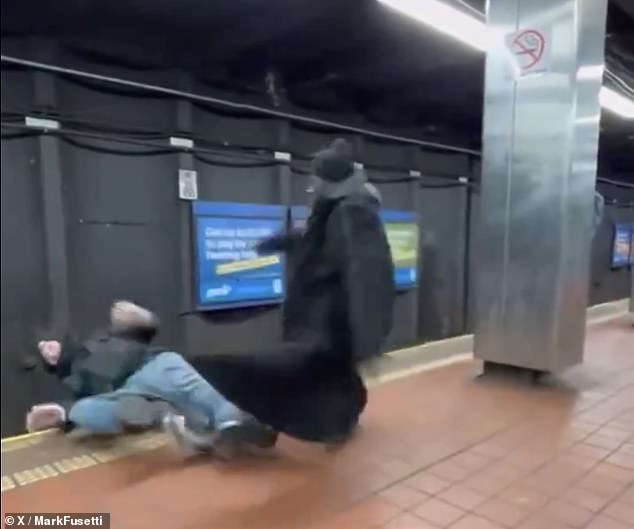 Bystander video captured the tragic moment when one of the men punched the other, causing him to stumble on the tracks.