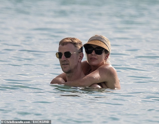 The couple - who tied the knot in 2015 - looked loved up as they enjoyed an evening dip, with Kimberly wrapping her arms around her other half.